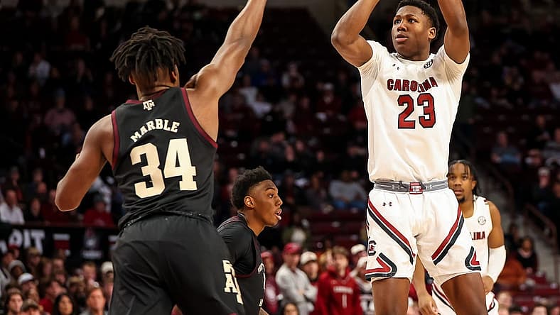 Jan 14, 2023; Columbia, South Carolina, USA; South Carolina Gamecocks forward Gregory Jackson II (23) shoots over Texas A&M Aggies forward Julius Marble (34) in the first half at Colonial Life Arena. Mandatory Credit: Jeff Blake-USA TODAY Sports