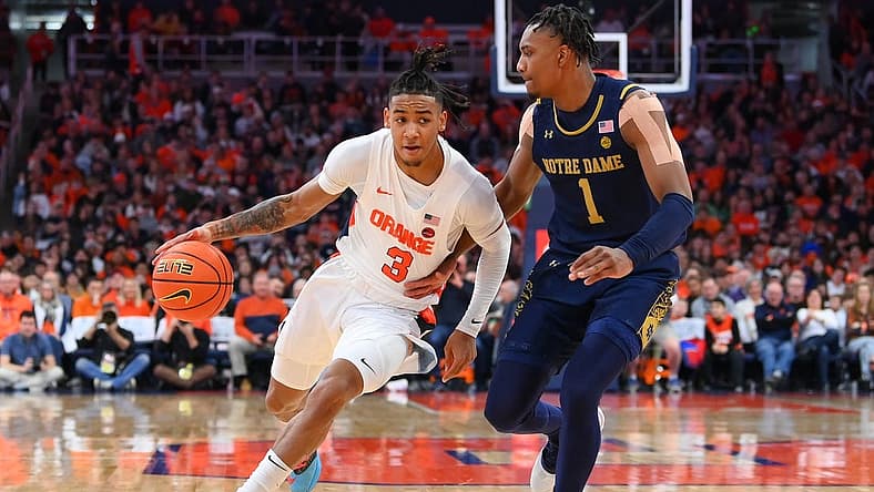 Jan 14, 2023; Syracuse, New York, USA; Syracuse Orange guard Judah Mintz (3) drives to the basket as Notre Dame Fighting Irish guard J.J. Starling (1) defends during the first half at the JMA Wireless Dome. Mandatory Credit: Rich Barnes-USA TODAY Sports