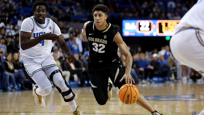 Jan 14, 2023; Los Angeles, California, USA; Colorado Buffaloes guard Nique Clifford (32) dribbles the ball against UCLA Bruins guard Will McClendon (4) during the first half at Pauley Pavilion presented by Wescom. Mandatory Credit: Kiyoshi Mio-USA TODAY Sports
