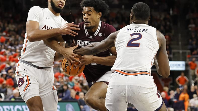 Jan 14, 2023; Auburn, Alabama, USA; Auburn Tigers forwards Johni Broome (4) and Auburn Jaylin Williams (2) strip the ball from Mississippi State Bulldogs forward Tolu Smith (1) during the first half at Neville Arena. Mandatory Credit: John Reed-USA TODAY Sports