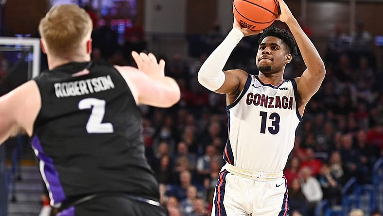 Jan 14, 2023; Spokane, Washington, USA; Gonzaga Bulldogs guard Malachi Smith (13) shoots the ball against Portland Pilots guard Tyler Robertson (2) in the second half at McCarthey Athletic Center. Mandatory Credit: James Snook-USA TODAY Sports