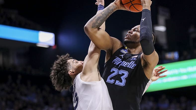 Jan 15, 2023; Cincinnati, Ohio, USA; Marquette Golden Eagles forward David Joplin (23) shoots against Xavier Musketeers guard Colby Jones (3) in the first half at Cintas Center. Mandatory Credit: Katie Stratman-USA TODAY Sports