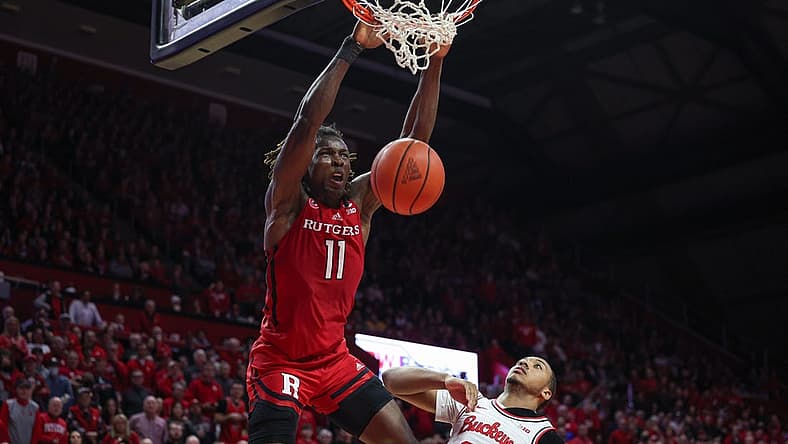 Jan 15, 2023; Piscataway, New Jersey, USA; Rutgers Scarlet Knights center Clifford Omoruyi (11) dunks over Ohio State Buckeyes forward Zed Key (23) in overtime at Jersey Mike's Arena. Mandatory Credit: Vincent Carchietta-USA TODAY Sports