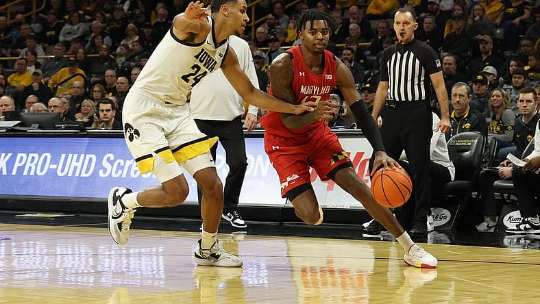 Jan 15, 2023; Iowa City, Iowa, USA; Iowa Hawkeyes forward Kris Murray (24) defends Maryland Terrapins forward Pavlo Dziuba (12) at Carver-Hawkeye Arena. Mandatory Credit: Reese Strickland-USA TODAY Sports