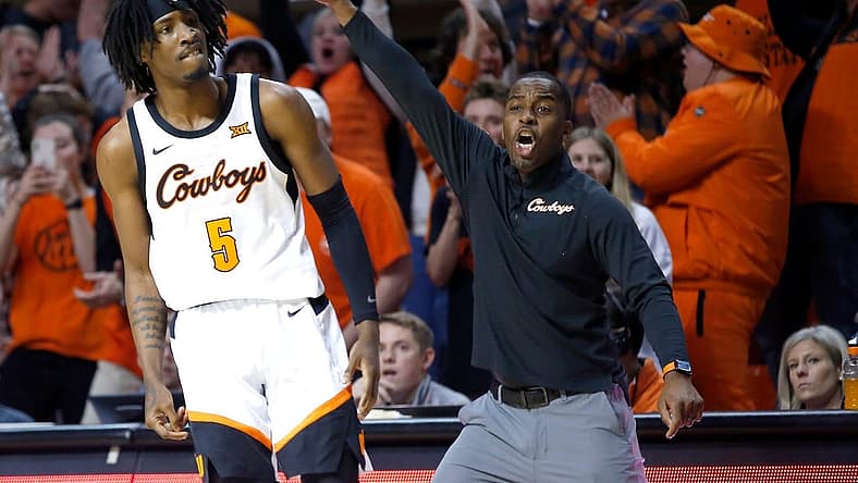 Oklahoma State head coach Mike Boynton and Caleb Asberry (5) react in the second half during the college basketball between the Oklahoma State Cowboys and the Texas Longhorns at Gallagher-Iba Arena in Stillwater, Okla., Saturday, Jan.7, 2023.
ss