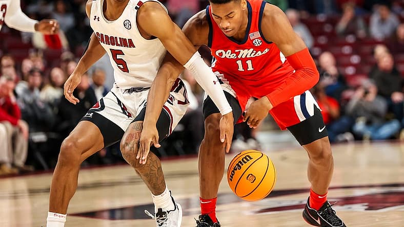 Jan 17, 2023; Columbia, South Carolina, USA; South Carolina Gamecocks guard Meechie Johnson (5) and Mississippi Rebels guard Matthew Murrell (11) battle for a loose ball in the first half at Colonial Life Arena. Mandatory Credit: Jeff Blake-USA TODAY Sports
