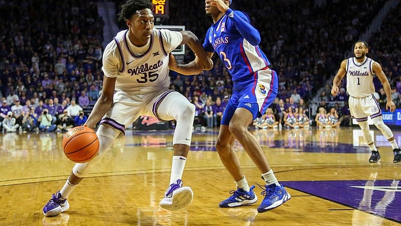 Jan 17, 2023; Manhattan, Kansas, USA; Kansas State Wildcats forward Nae'Qwan Tomlin (35) dribbles against Kansas Jayhawks guard DaJuan Harris Jr. (3) during the first half at Bramlage Coliseum. Mandatory Credit: Scott Sewell-USA TODAY Sports