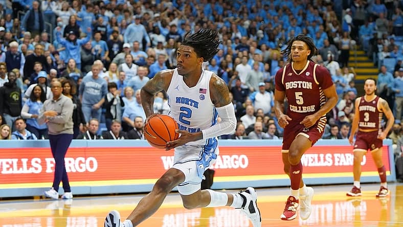 Jan 17, 2023; Chapel Hill, North Carolina, USA; North Carolina Tar Heels guard Caleb Love (2) on a break away as Boston College Eagles guard DeMarr Langford Jr. (5) defends in the second half at Dean E. Smith Center. Mandatory Credit: Bob Donnan-USA TODAY Sports