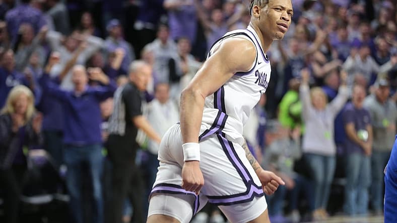 Kansas State senior forward Keyontae Johnson (11) looks back at his team after a dunk in overtime of Tuesday's Sunflower Showdown against Kansas inside Bramlage Coliseum.