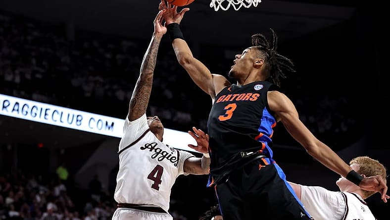 Jan 18, 2023; College Station, Texas, USA; Texas A&M Aggies guard Wade Taylor IV (4) and Florida Gators forward Alex Fudge (3) pursue a rebound during the first half at Reed Arena. Mandatory Credit: Erik Williams-USA TODAY Sports