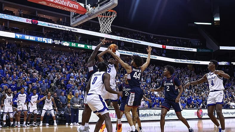 Jan 18, 2023; Newark, New Jersey, USA; Seton Hall Pirates forward KC Ndefo (13) scores a basket after being fouled by Connecticut Huskies forward Adama Sanogo (21) during the second half in front of guard Kadary Richmond (0) and guard Andre Jackson Jr. (44) at Prudential Center. Mandatory Credit: Vincent Carchietta-USA TODAY Sports