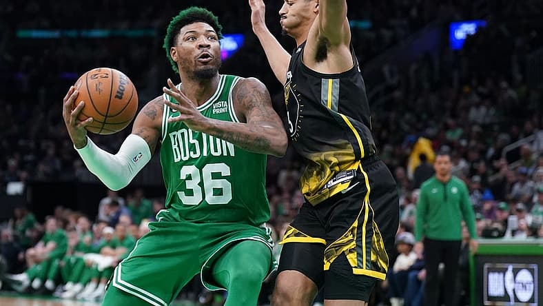 Jan 19, 2023; Boston, Massachusetts, USA; Boston Celtics guard Marcus Smart (36) drives the ball against Golden State Warriors guard Jordan Poole (3) in the second half at TD Garden. Mandatory Credit: David Butler II-USA TODAY Sports