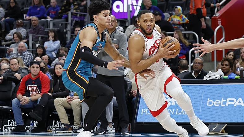 Jan 28, 2023; Detroit, Michigan, USA; Houston Rockets guard Eric Gordon (10) dribbles on Detroit Pistons guard Killian Hayes (7) in the first half at Little Caesars Arena. Mandatory Credit: Rick Osentoski-USA TODAY Sports