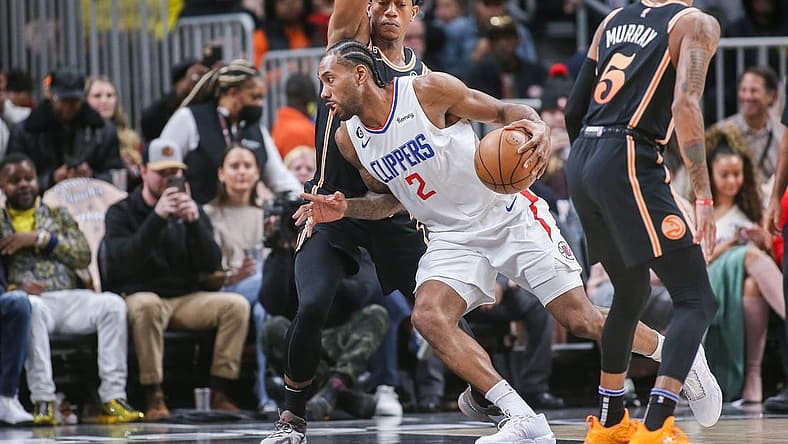 Jan 28, 2023; Atlanta, Georgia, USA; LA Clippers forward Kawhi Leonard (2) is defended by Atlanta Hawks forward De'Andre Hunter (12) in the first quarter at State Farm Arena. Mandatory Credit: Brett Davis-USA TODAY Sports