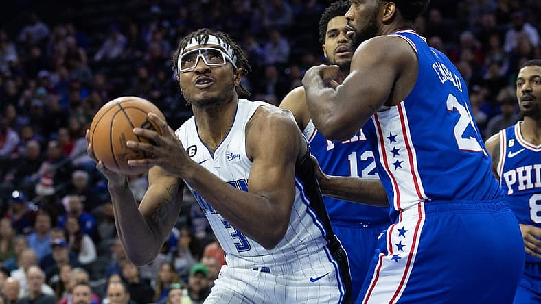 Jan 30, 2023; Philadelphia, Pennsylvania, USA; Orlando Magic center Wendell Carter Jr. (34) controls the ball in front of Philadelphia 76ers center Joel Embiid (21) during the first quarter at Wells Fargo Center. Mandatory Credit: Bill Streicher-USA TODAY Sports