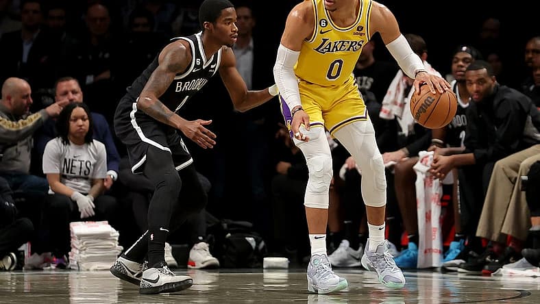 Jan 30, 2023; Brooklyn, New York, USA; Los Angeles Lakers guard Russell Westbrook (0) controls the ball against Brooklyn Nets guard Edmond Sumner (4) during the second quarter at Barclays Center. Mandatory Credit: Brad Penner-USA TODAY Sports