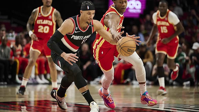 Jan 30, 2023; Portland, Oregon, USA; Portland Trail Blazers guard Josh Hart (11) controls the basketball during the first half against Atlanta Hawks forward De'Andre Hunter (12) at Moda Center. Mandatory Credit: Troy Wayrynen-USA TODAY Sports