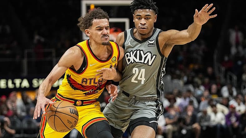 Apr 2, 2022; Atlanta, Georgia, USA; Atlanta Hawks guard Trae Young (11) is guarded by Brooklyn Nets guard Cam Thomas (24) during the second half at State Farm Arena. Mandatory Credit: Dale Zanine-USA TODAY Sports