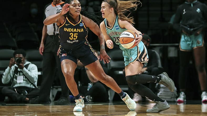 Jun 1, 2022; Brooklyn, New York, USA; New York Liberty guard Sabrina Ionescu (20) drives past Indiana Fever guard Victoria Vivians (35) in the first quarter at Barclays Center. Mandatory Credit: Wendell Cruz-USA TODAY Sports