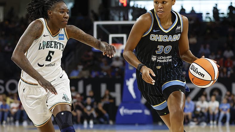 Aug 20, 2022; Chicago, Illinois, USA; Chicago Sky forward Azura Stevens (30) drives to the basket against New York Liberty forward Natasha Howard (6) during the first half of Game 2 of the first round of the WNBA playoffs at Wintrust Arena. Mandatory Credit: Kamil Krzaczynski-USA TODAY Sports