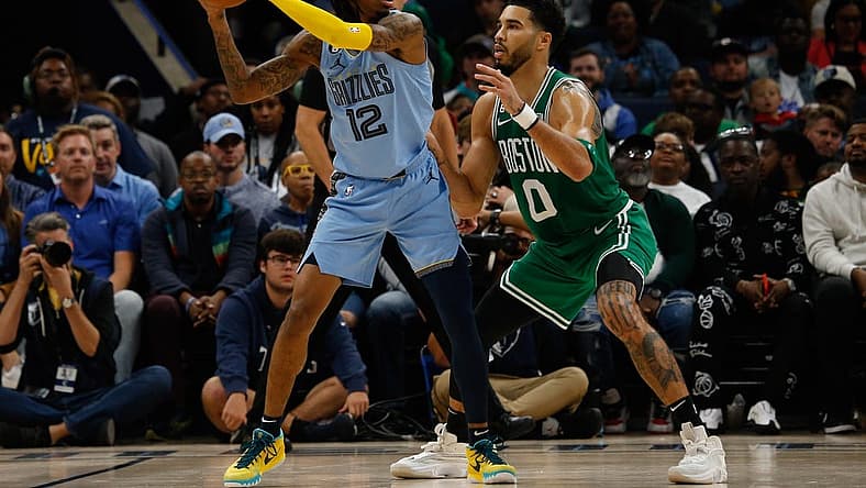 Nov 7, 2022; Memphis, Tennessee, USA; Memphis Grizzlies guard Ja Morant (12) and Boston Celtics forward Jayson Tatum (0) during the second half at FedExForum. Mandatory Credit: Petre Thomas-USA TODAY Sports