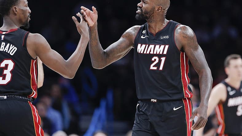 Dec 14, 2022; Oklahoma City, Oklahoma, USA; Miami Heat center Dewayne Dedmon (21) high fives center Bam Adebayo (13) between plays against the Oklahoma City Thunder during the second quarter at Paycom Center. Mandatory Credit: Alonzo Adams-USA TODAY Sports