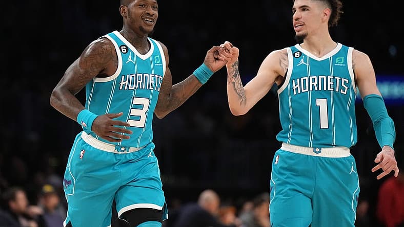 Dec 23, 2022; Los Angeles, California, USA; Charlotte Hornets guard Terry Rozier (3) celebrates with guard LaMelo Ball (1) after a three-point basket in the second half against the Los Angeles Lakers at Crypto.com Arena. The Hornets defeated the Lakers 134-130. Mandatory Credit: Kirby Lee-USA TODAY Sports