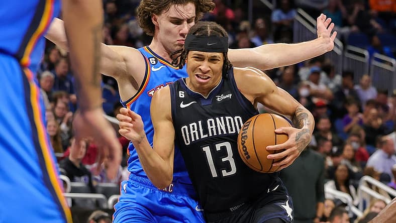 Jan 4, 2023; Orlando, Florida, USA; Orlando Magic guard R.J. Hampton (13) is fouled by Oklahoma City Thunder guard Josh Giddey (3) during the second half at Amway Center. Mandatory Credit: Mike Watters-USA TODAY Sports