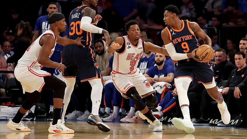 Feb 2, 2023; New York, New York, USA; New York Knicks guard RJ Barrett (9) controls the ball against Miami Heat guard Kyle Lowry (7) during the first quarter at Madison Square Garden. Mandatory Credit: Brad Penner-USA TODAY Sports