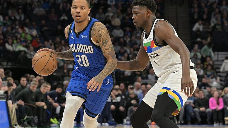 Feb 3, 2023; Minneapolis, Minnesota, USA; Orlando Magic guard Markelle Fultz (20) is defended by Minnesota Timberwolves guard Anthony Edwards (1) during the first quarter at Target Center. Mandatory Credit: Jeffrey Becker-USA TODAY Sports