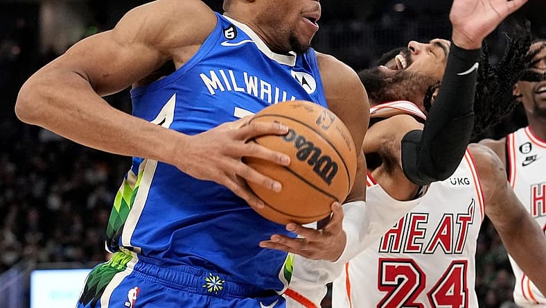 Bucks forward Giannis Antetokounmpo collides with Heat guard Gabe Vincent on a drive to the rim during the second half Saturday night at Fiserv Forum.
Mjs Bucks04 11 Jpg Bucks04