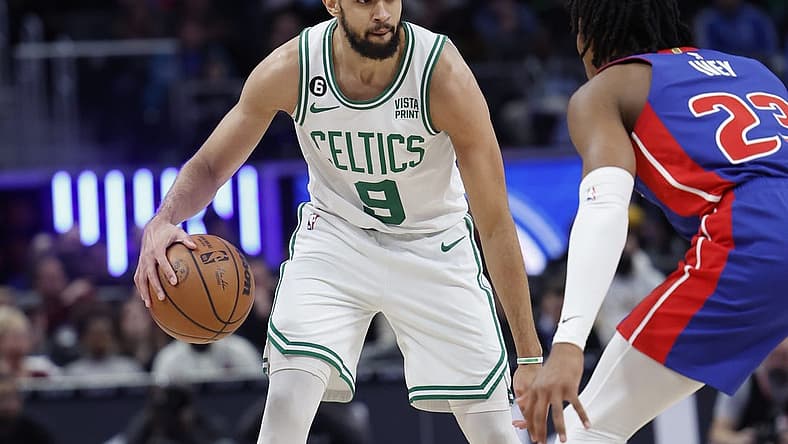 Feb 6, 2023; Detroit, Michigan, USA; Boston Celtics guard Derrick White (9) dribbles defended by Detroit Pistons guard Jaden Ivey (23) in the first half at Little Caesars Arena. Mandatory Credit: Rick Osentoski-USA TODAY Sports