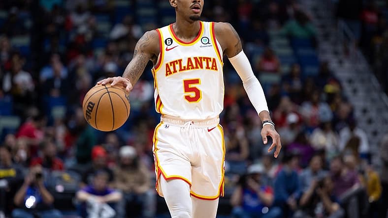Feb 7, 2023; New Orleans, Louisiana, USA; Atlanta Hawks guard Dejounte Murray (5) brings the ball up court against the New Orleans Pelicans during the first half at Smoothie King Center. Mandatory Credit: Stephen Lew-USA TODAY Sports
