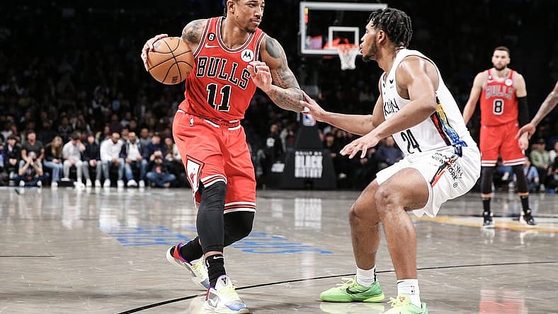 Feb 9, 2023; Brooklyn, New York, USA; Chicago Bulls forward DeMar DeRozan (11) looks to drive past Brooklyn Nets guard Cam Thomas (24) in the fourth quarter at Barclays Center. Mandatory Credit: Wendell Cruz-USA TODAY Sports