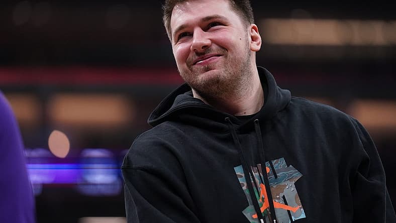 Feb 10, 2023; Sacramento, California, USA; Dallas Mavericks guard Luka Doncic (77) stands on the court during a timeout against the Sacramento Kings in the first quarter at the Golden 1 Center. Mandatory Credit: Cary Edmondson-USA TODAY Sports