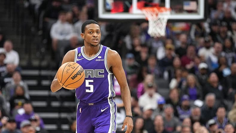 Feb 11, 2023; Sacramento, California, USA; Sacramento Kings guard De'Aaron Fox (5) dribbles against the Dallas Mavericks during the fourth quarter at Golden 1 Center. Mandatory Credit: Darren Yamashita-USA TODAY Sports