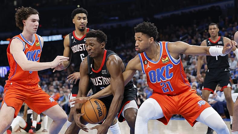 Feb 15, 2023; Oklahoma City, Oklahoma, USA; Houston Rockets forward Jae'Sean Tate (8) looses control of the ball between Oklahoma City Thunder guard Aaron Wiggins (21) and guard Josh Giddey (3) during the second quarter at Paycom Center. Mandatory Credit: Alonzo Adams-USA TODAY Sports