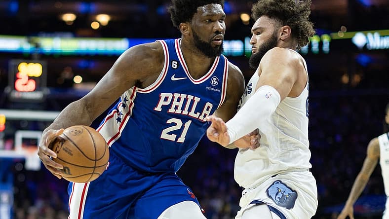 Feb 23, 2023; Philadelphia, Pennsylvania, USA; Philadelphia 76ers center Joel Embiid (21) drives against Memphis Grizzlies forward David Roddy (27) during the second quarter at Wells Fargo Center. Mandatory Credit: Bill Streicher-USA TODAY Sports