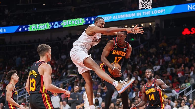 Feb 24, 2023; Atlanta, Georgia, USA; Cleveland Cavaliers forward Evan Mobley (4) and Atlanta Hawks forward Onyeka Okongwu (17) reach for a rebound in the second quarter at State Farm Arena. Mandatory Credit: Brett Davis-USA TODAY Sports