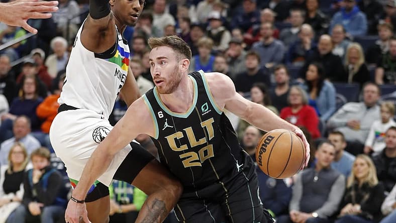 Feb 24, 2023; Minneapolis, Minnesota, USA; Charlotte Hornets forward Gordon Hayward (20) works around Minnesota Timberwolves forward Jaden McDaniels (3) in the first quarter at Target Center. Mandatory Credit: Bruce Kluckhohn-USA TODAY Sports