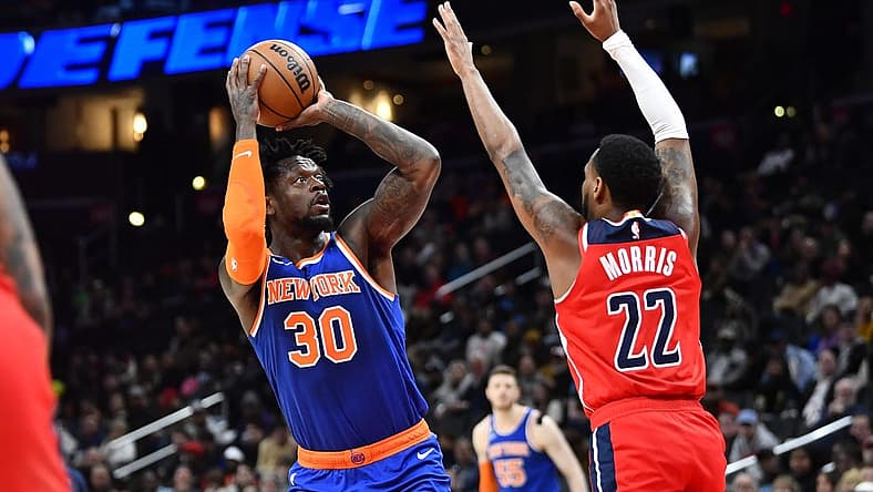 Feb 24, 2023; Washington, District of Columbia, USA; New York Knicks forward Julius Randle (30) shoots over Washington Wizards guard Monte Morris (22) during the first half at Capital One Arena. Mandatory Credit: Brad Mills-USA TODAY Sports