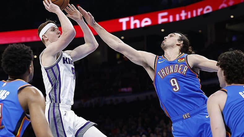 Feb 26, 2023; Oklahoma City, Oklahoma, USA; Oklahoma City Thunder forward Dario Saric (9) defends a shot by Sacramento Kings guard Kevin Huerter (9) during the second quarter at Paycom Center. Mandatory Credit: Alonzo Adams-USA TODAY Sports