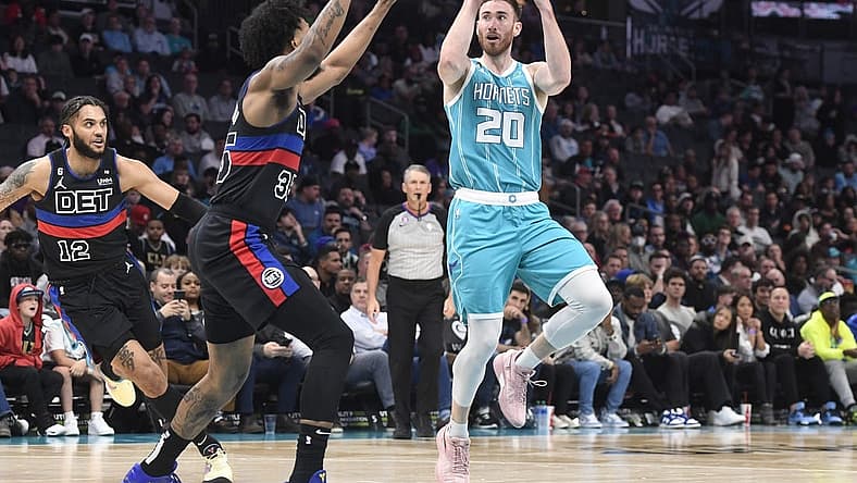 Feb 27, 2023; Charlotte, North Carolina, USA; Charlotte Hornets forward Gordon Hayward (20) shoots as he is defended by Detroit Pistons forward Marvin Bagley III (35) during the first half at the Spectrum Center. Mandatory Credit: Sam Sharpe-USA TODAY Sports