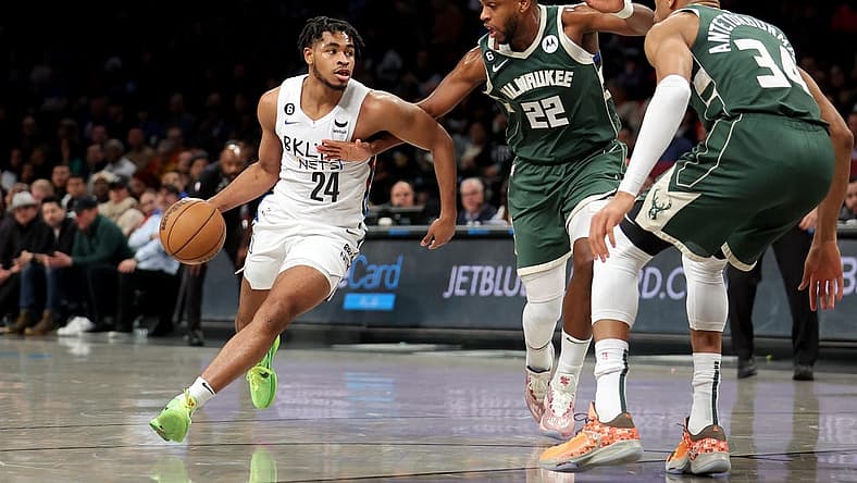 Feb 28, 2023; Brooklyn, New York, USA; Brooklyn Nets guard Cam Thomas (24) controls the ball against Milwaukee Bucks forward Khris Middleton (22) and forward Giannis Antetokounmpo (34) during the first quarter at Barclays Center. Mandatory Credit: Brad Penner-USA TODAY Sports