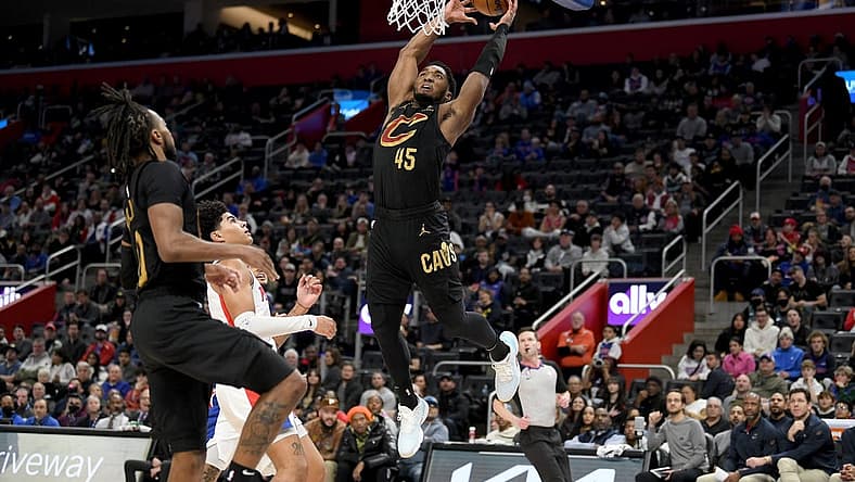 Nov 27, 2022; Detroit, Michigan, USA;  Cleveland Cavaliers guard Donovan Mitchell (45) tries to finish off an alley-oop against the Detroit Pistons in the second quarter at Little Caesars Arena. Mandatory Credit: Lon Horwedel-USA TODAY Sports