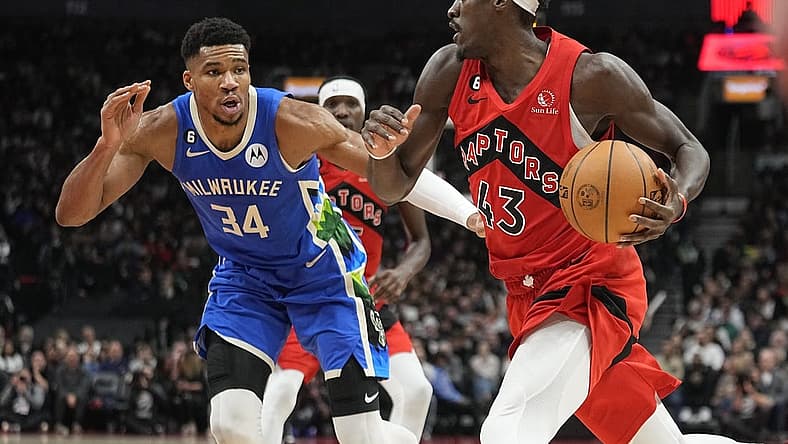 Jan 4, 2023; Toronto, Ontario, CAN; Toronto Raptors forward Pascal Siakam (43) drives to the net against Milwaukee Bucks forward Giannis Antetokounmpo (34) during the first half at Scotiabank Arena. Mandatory Credit: John E. Sokolowski-USA TODAY Sports