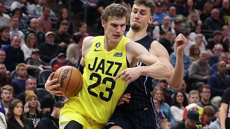 Jan 13, 2023; Salt Lake City, Utah, USA; Utah Jazz forward Lauri Markkanen (23) drives with the ball against Orlando Magic forward Franz Wagner (22) in the second half at Vivint Arena. Mandatory Credit: Rob Gray-USA TODAY Sports