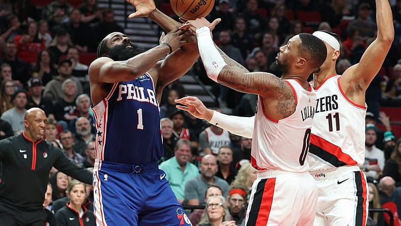 Jan 19, 2023; Portland, Oregon, USA; Philadelphia 76ers guard James Harden (1) looses the ball to Portland Trail Blazers guard Damian Lillard (0) in the second half at Moda Center. Mandatory Credit: Jaime Valdez-USA TODAY Sports