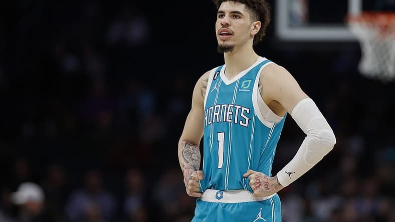 Feb 15, 2023; Charlotte, North Carolina, USA; Charlotte Hornets guard LaMelo Ball (1) stands on the court during the second half against the San Antonio Spurs at Spectrum Center. The Charlotte Hornets won 120-110. Mandatory Credit: Nell Redmond-USA TODAY Sports