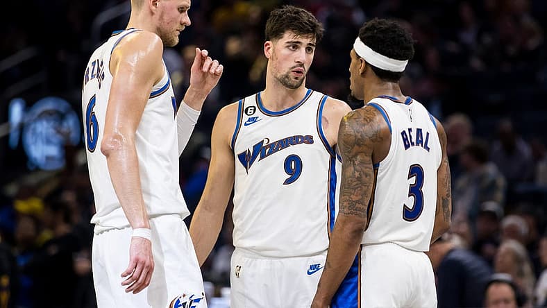 Feb 13, 2023; San Francisco, California, USA; Washington Wizards center Kristaps Porzingis (6) and forward Deni Avdija (9) and guard Bradley Beal (3) talk during the second half of the game against the Golden State Warriors at Chase Center. Mandatory Credit: John Hefti-USA TODAY Sports